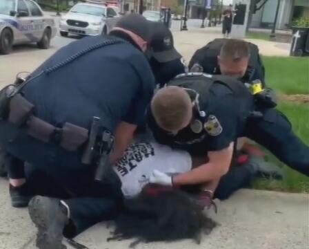 Louisville Metro Police officers arresting Denorver Garrett at Jefferson Square Park